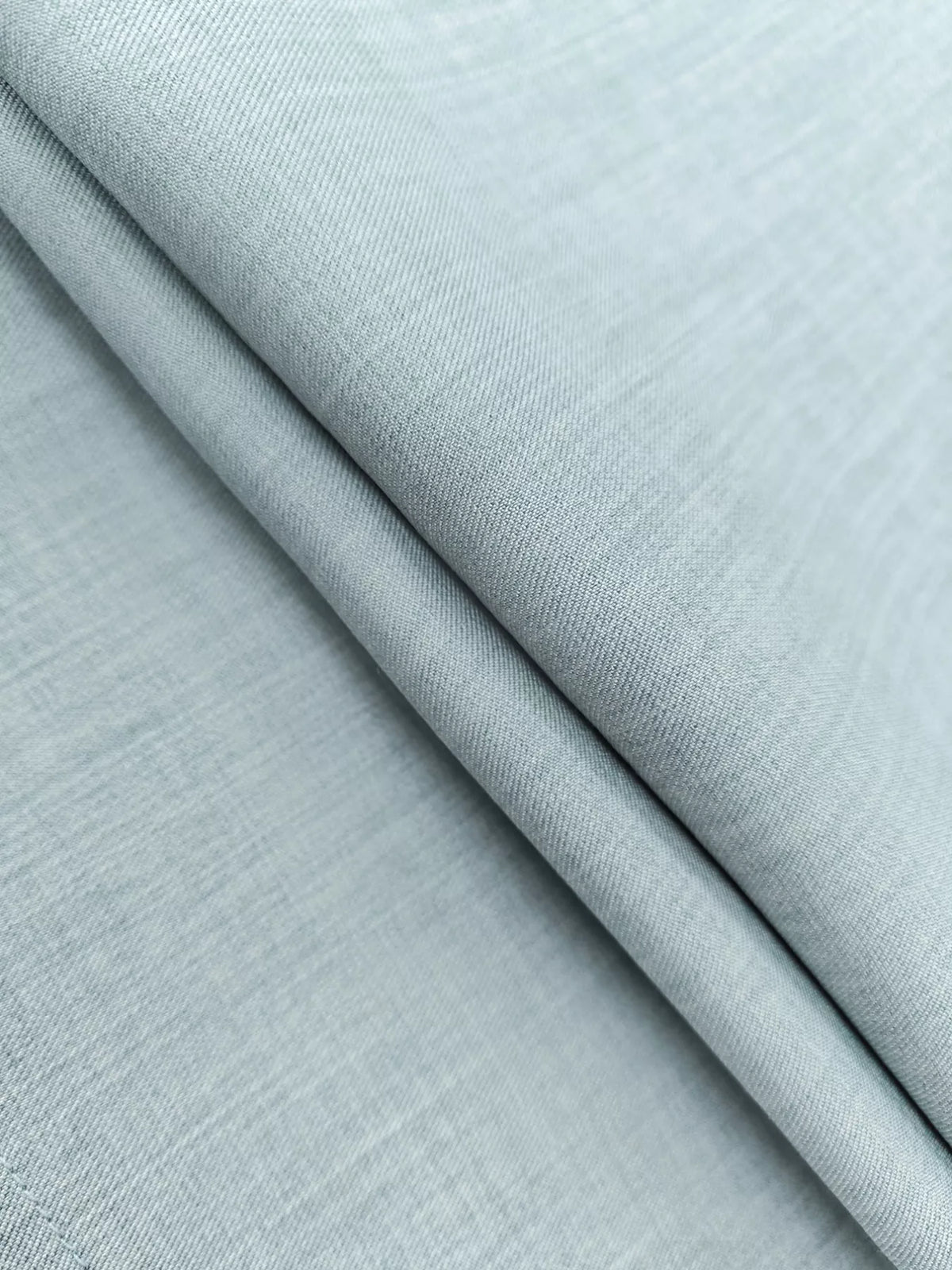 Close-up of light grey fashion fabric texture, ideal for apparel at Shopimist