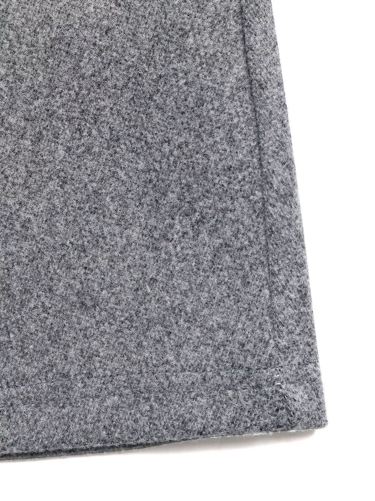 Close-up of gray wool fabric skirt hem, Shopimist trendy women’s apparel detail