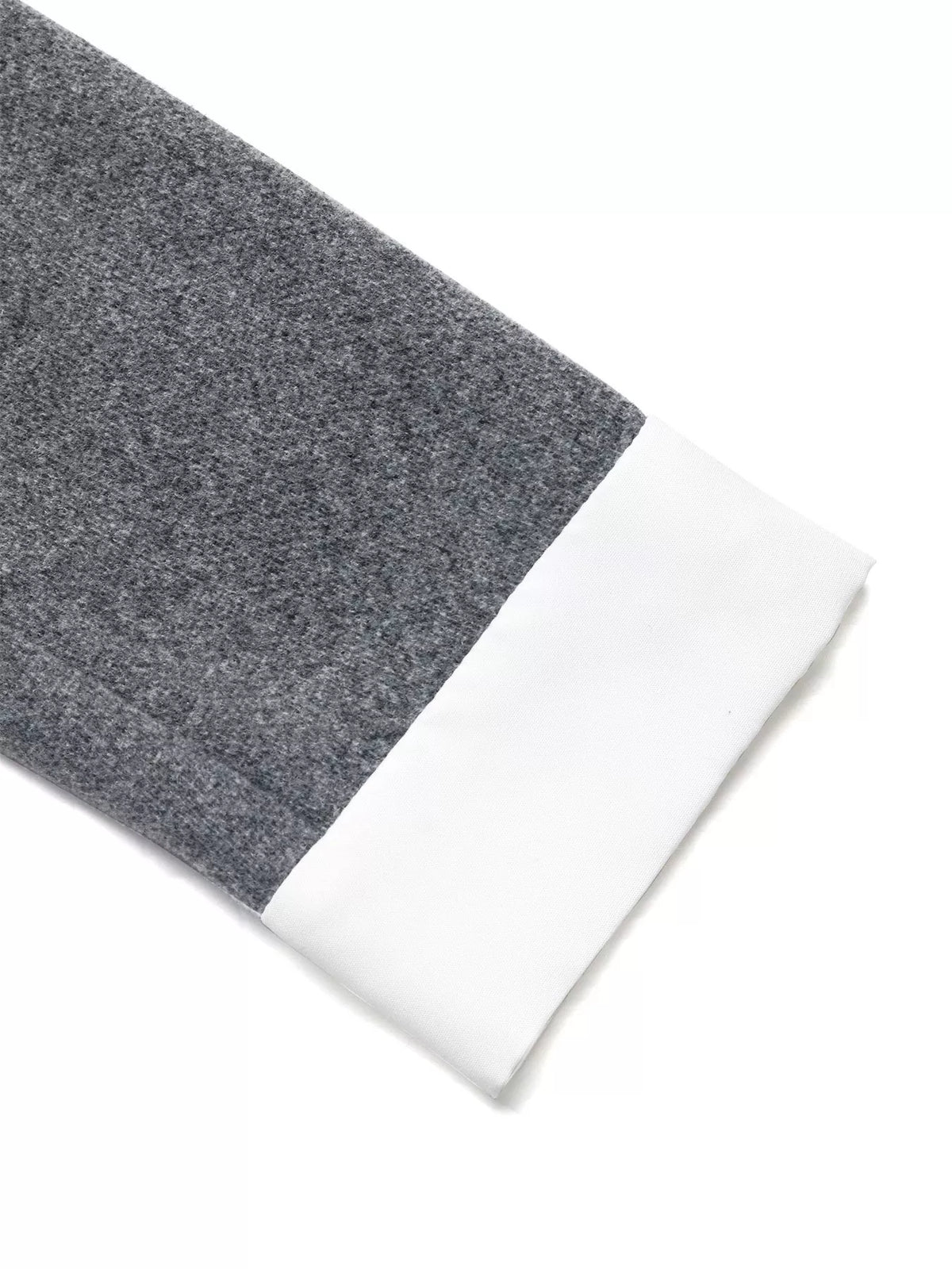 Gray fabric sleeve with white cuff, stylish apparel detail from Shopimist fashion collection