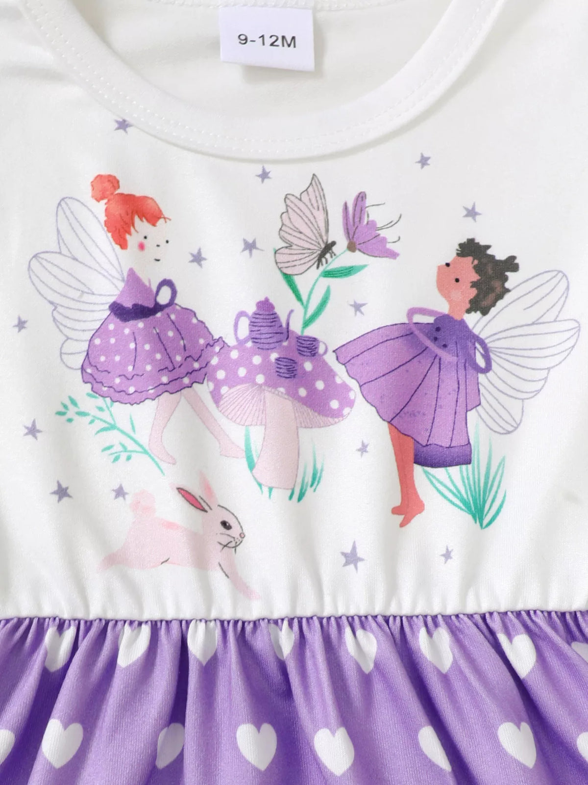 Infant dress with fairy tea party print, purple hearts, and whimsical floral accents