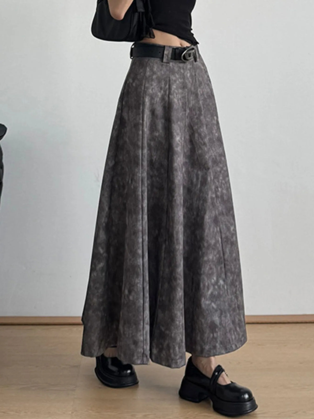 Woman wearing a gray maxi skirt with black belt, black crop top, and chunky shoes, Shopimist fashion