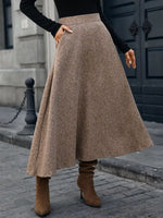 Woman in brown wool midi skirt and suede boots on city street, Shopimist fashion