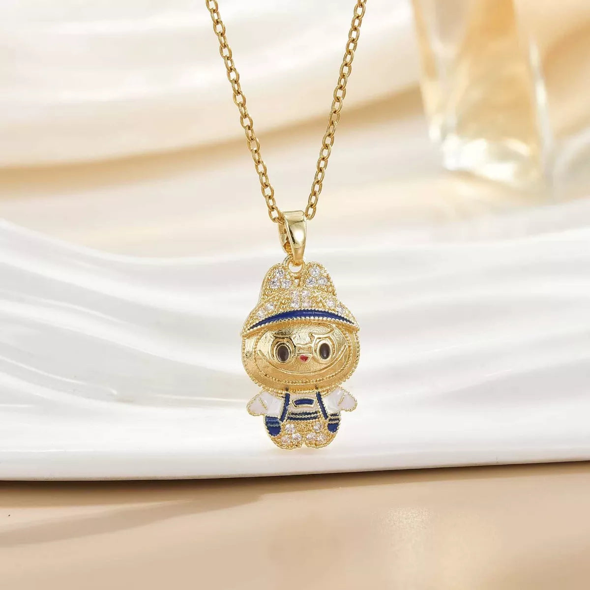 Gold cartoon character pendant necklace with enamel details on a white background, Shopimist fashion jewelry