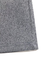 Close-up of gray wool fabric skirt hem, Shopimist trendy women’s apparel detail