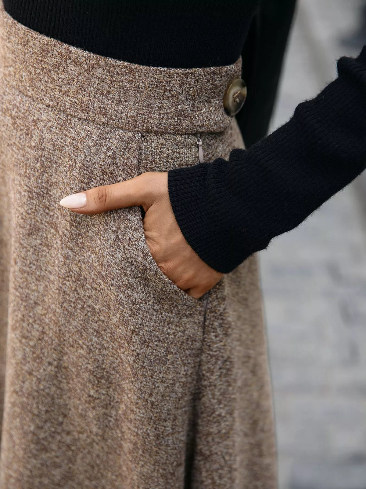 Woman in cozy brown tweed skirt with pocket detail, wearing black sweater, Shopimist fashion