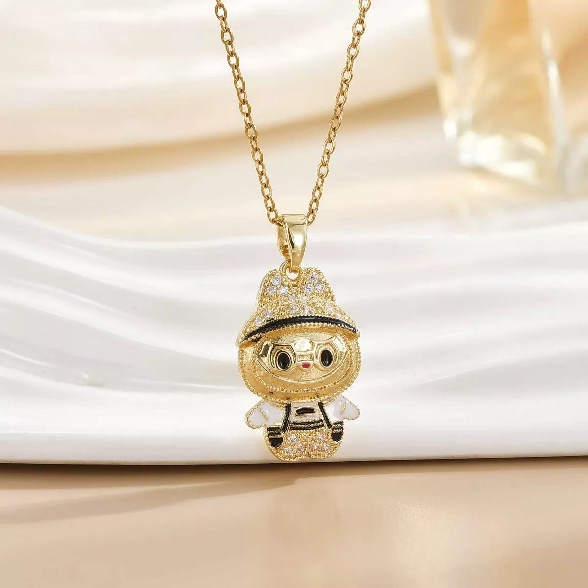 Gold cartoon character pendant necklace with sparkling accents on a chain, Shopimist fashion jewelry