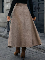 Woman wearing a brown wool maxi skirt and heeled boots, street style fashion by Shopimist