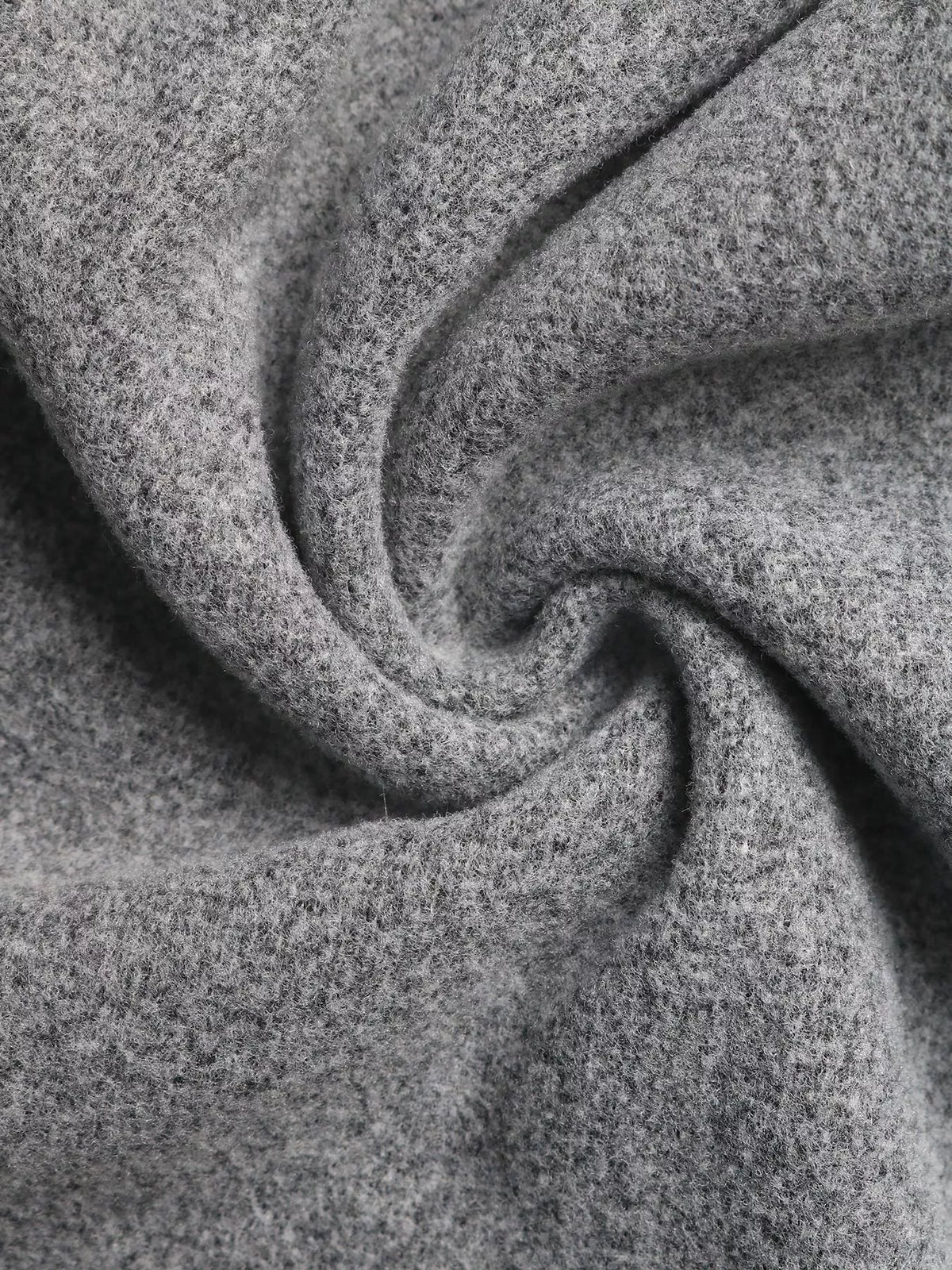 Close-up of soft grey fabric texture, ideal for Shopimist cozy fashion apparel and accessories.