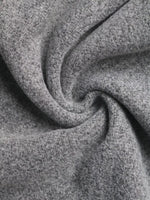 Close-up of soft grey fabric texture, ideal for Shopimist cozy fashion apparel and accessories.